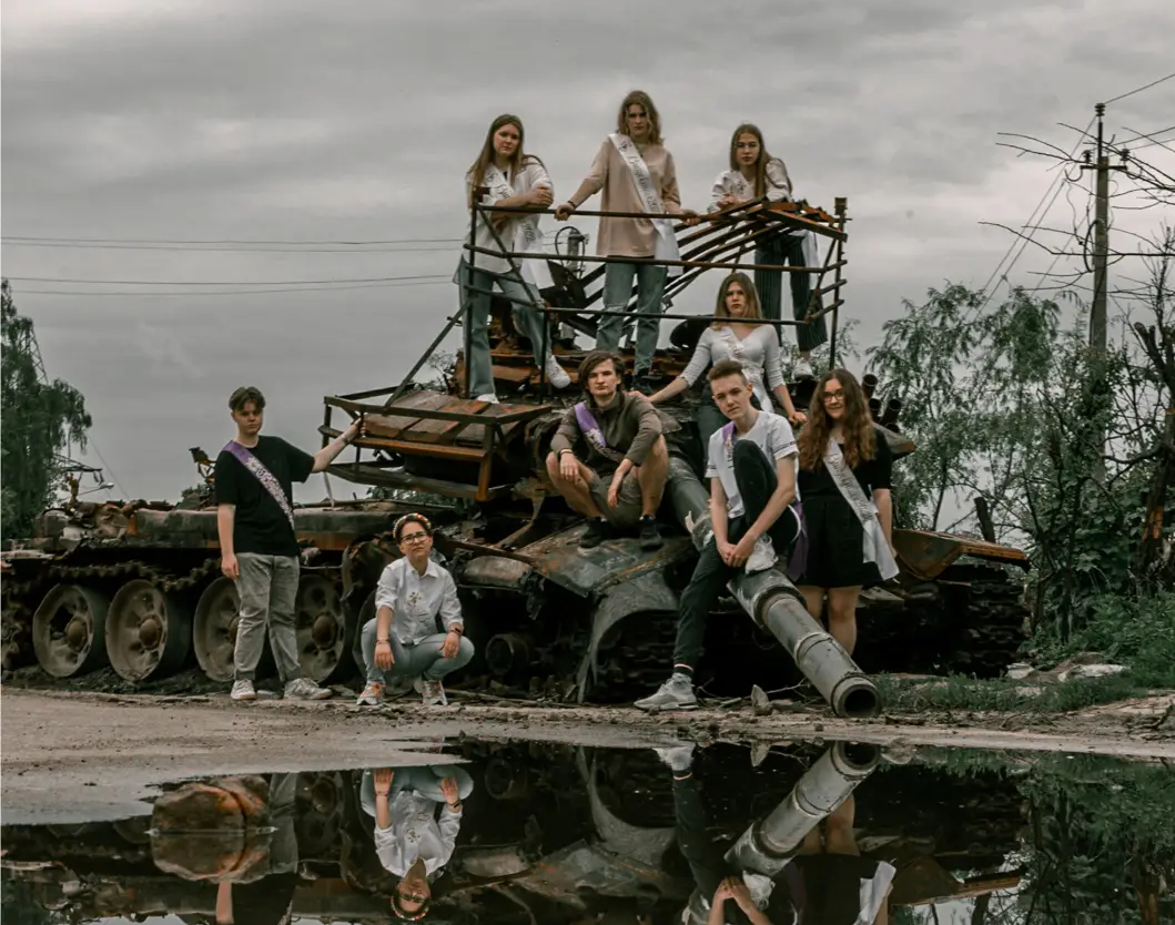 High school students pose in front of a destroyed military vehicle for a graduation photo in Ukraine’s war-torn

Chernihiv on June 5, 2022.
Credit: Stanislav Senyk @senykstas (on Instagram)
