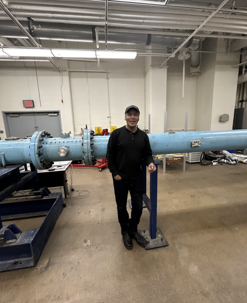 Mr. Hernandez with a shock tube for high speed turbulence research.