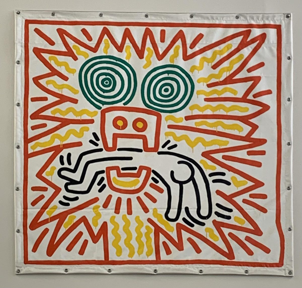 Original art by Keith Haring, located among many other pieces of art on the second floor of the CCNY Cohen Library. Photo taken by Esther Gould.