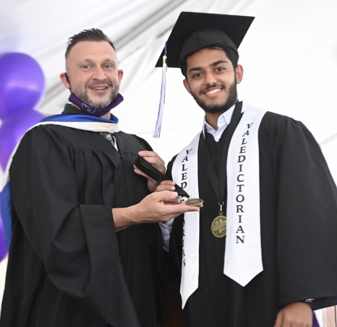 Kumayl and then-Assistant Principal Dolcy at graduation in 2021.
