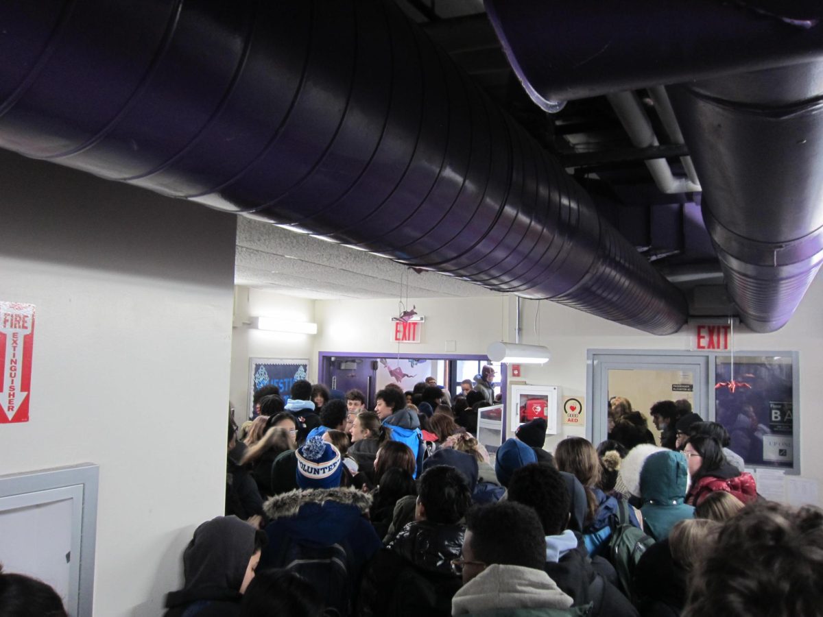 Students crowd the B-floor hallway waiting to sign out and exit Baskerville Hall.